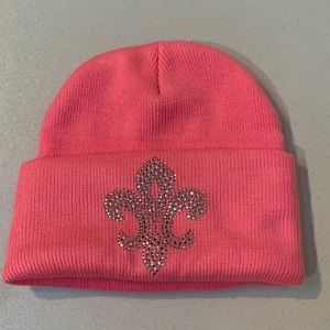 Pink knit stocking hat with bling fleur de lis design. One size. Gently used.